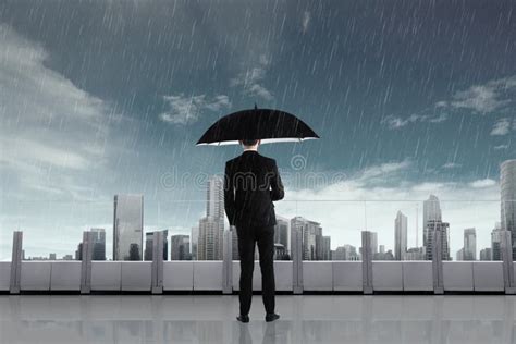 Businessman In The Rain With Umbrella Stock Image Image Of Terrace