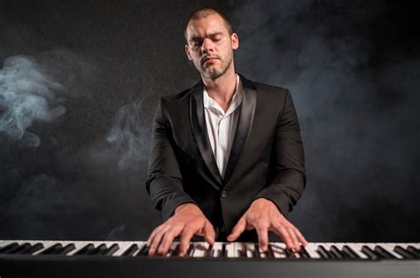 Free Photo Passionate Musician Playing Chords On Piano Smoke Effect