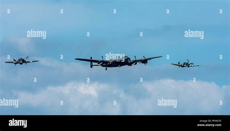 A Hurricane And Spitfire Escort The Avro Lancaster At The Start Of The
