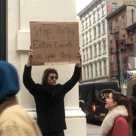 Dude With Sign Holds Up Random Protest Signs With Declarations That