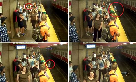 Mother Carrying Her Four Year Old Son Falls On To Tracks At Subway Station After Failing To See