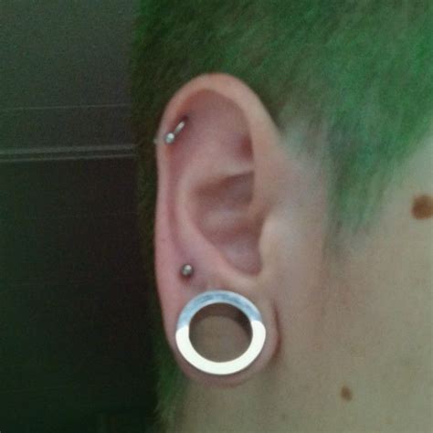 Boy With Stretched Earlobe With Mm Tunnel Nd Lobe Piercing And