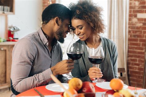 African American Couple Enjoying Romantic Dinner At Home Stock Photo By
