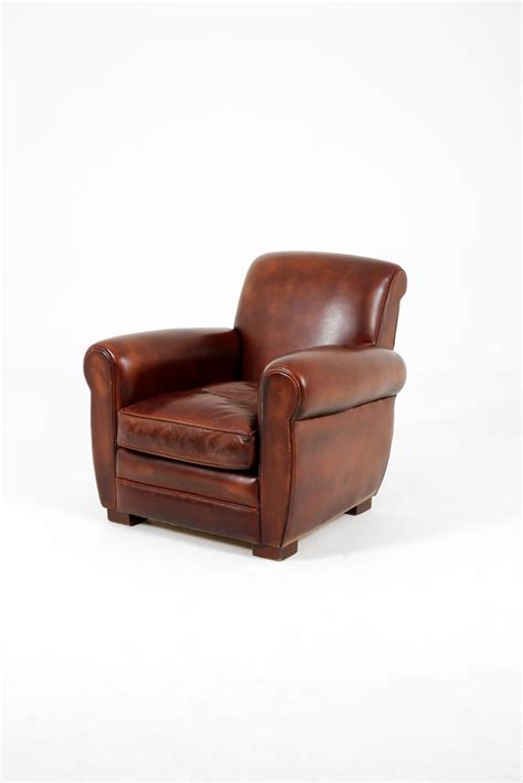 Designed with the traditional chesterfield style in mind, this velvet armchair hits all the key elements, with deep button tufting, nailhead accents, scrolled arms, and turned wooden legs. Traditional brown leather armchair | Hire & Rental ...