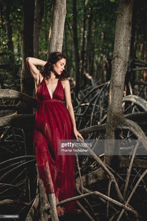 Beautiful Woman In Red Dress High Res Stock Photo Getty Images