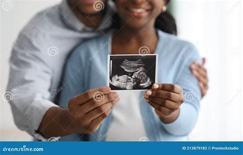 Closeup Of Baby Sonogram In Black Couple Hands Stock Photo Image Of