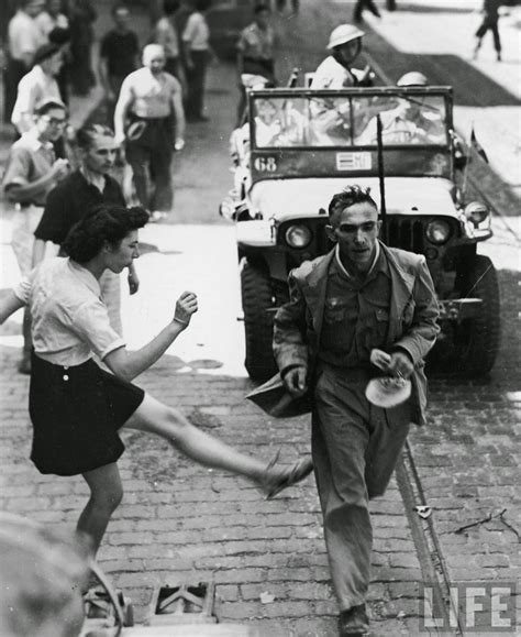 A French Woman Vents Her Anger Towards A German Pow With A Kick 1944