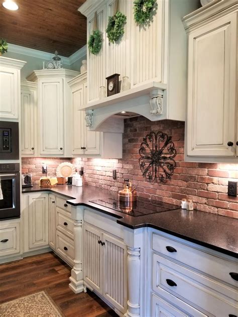 Transform an ordinary kitchen or bathroom into a stylish space. Farmhouse kitchen with brick backsplash and white cabinets | Brick kitchen, Brick backsplash ...