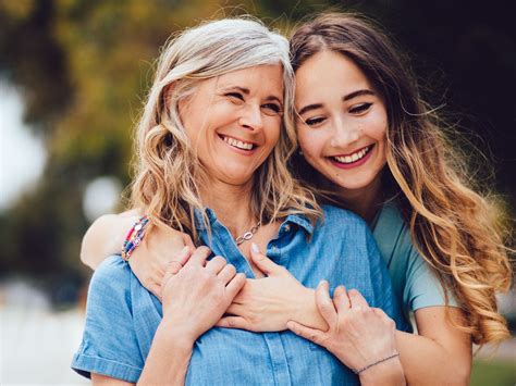 Adult Daughter Hugs Mom With Long Hair Mother Daughter Photography Poses Mother Daughter Poses