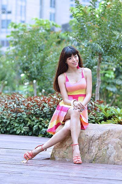 beautiful and sex asian girl shows her youth in the park stock image image of smile legs