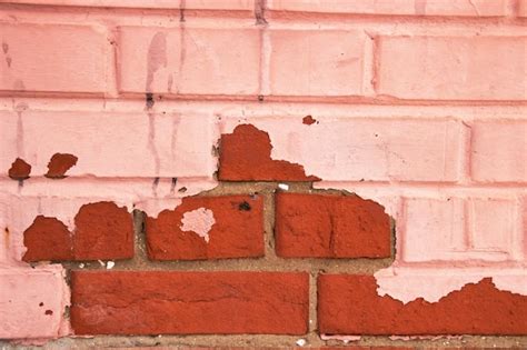 Premium Photo Peeling Red Paint On Brick Wall Background Or Texture