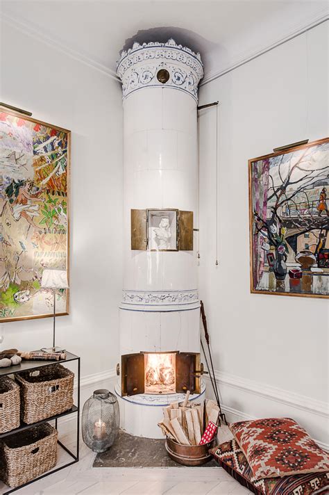 Charming original enameled ceramic fireplace wood burning stove. Scandinavian Style Home With A Greek Twist