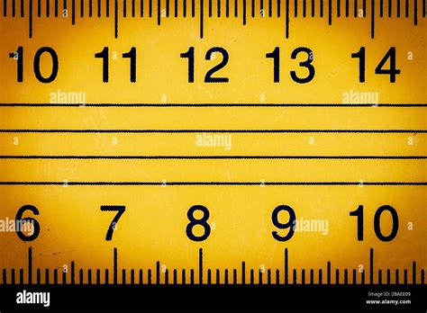 Yellow Metal Ruler Close Up With Millimeters And Centimeters Stock