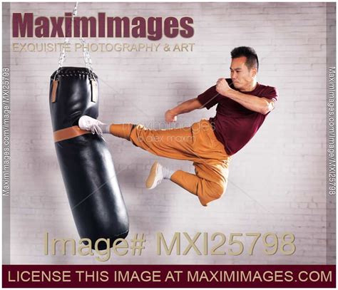 Photo Of Martial Artist Practicing Flying Kick Stock Image Mxi25798