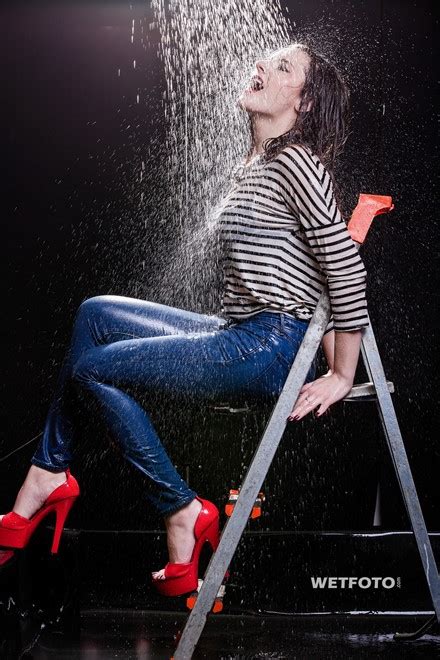 wetlook by pretty girl in striped sweater high waisted jeans and red high heels