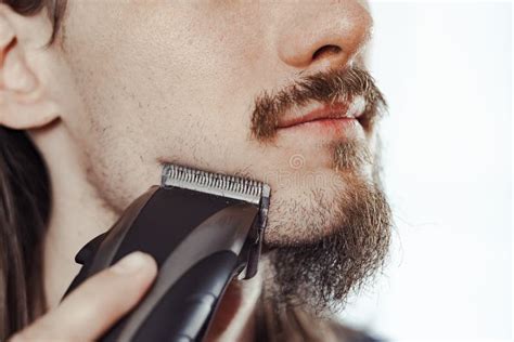 Guy Shaves His Beard With An Electric Razor Stock Image Image Of Handsome Adult 154147631