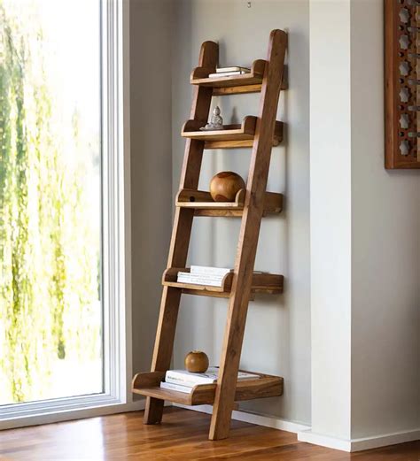 A Wooden Ladder Leaning Against The Wall With Books On It