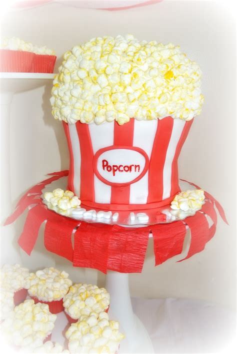 A large round cake forms the base of this design, which celebrates dennis hopper and easy rider, though you can modify this idea for any of your favorite films or actors.the cake is covered in gray rolled fondant to look like a film reel case and has white fondant stars. Popcorn Themed Cake And Cupcakes All Edible Fondant And ...
