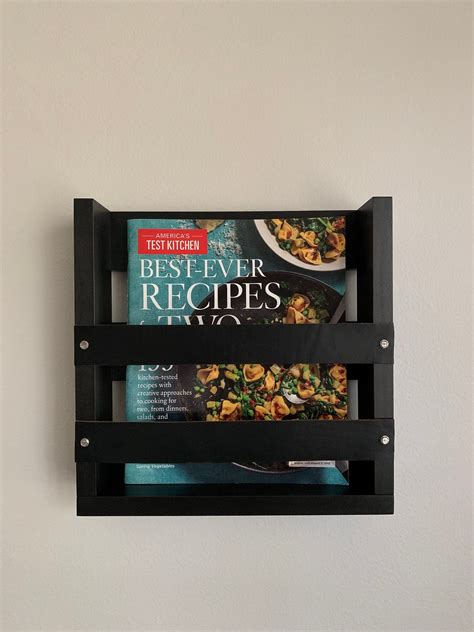 Wall mounted magazine rack with leather accents wall hanging