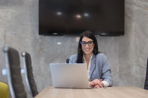 Businesswoman Using A Laptop In Startup Office Stock Image Image Of