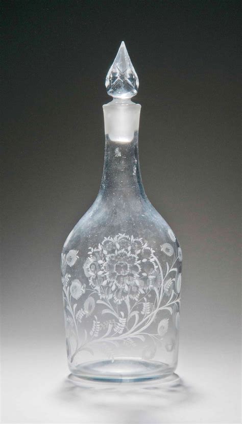 An English Engraved Glass Decanter And Stopper