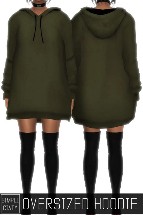 Two Women In Green Hoodies Standing Next To Each Other With Their Hands
