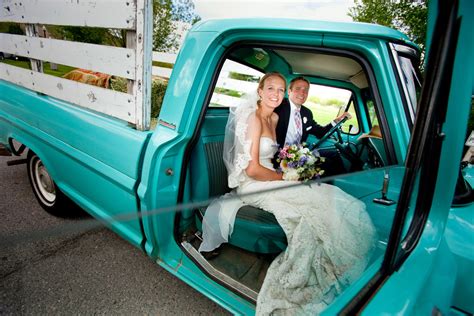 Bride And Groom Smile As They Head To Wedding Reception In Vintage