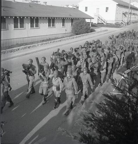 Trainees Marching With Heavy Equipment At Fort Ord — Calisphere