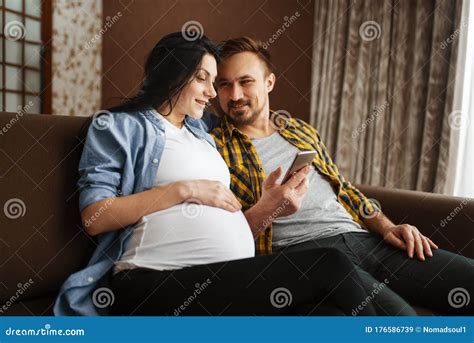 husband touching the belly of his pregnant wife stock image image of male care 176586739