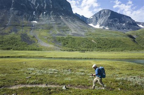 Hiking In Swedish Lapland Man Trekking Alone In Vistasvagge Valley In