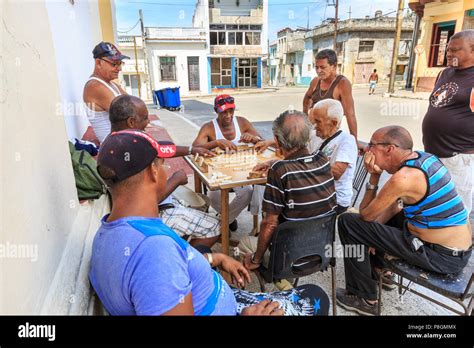 Cuban Men Playing Domino In A Street In Regla A Popular Leisure Game