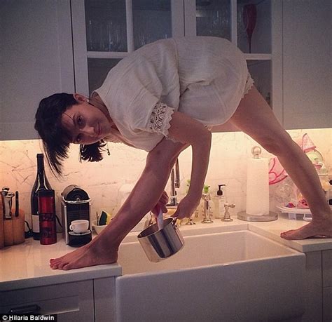 Hilaria Baldwin Shows Off Side Boob As She Bends Over Backwards To Kiss