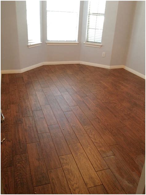 I still personally like the aesthetic of wood look tile, and there are certain tricks you can use to make them look even more like the real thing (see below), but you're never going to be able to replace the feel of. Tile that looks like wood! Love the durability. # ...