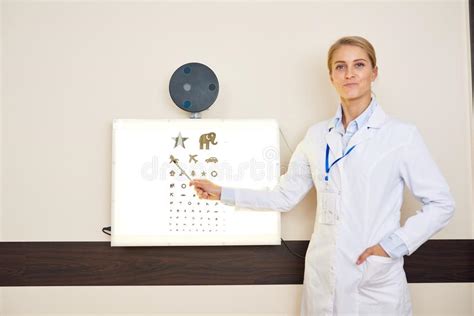 Ophthalmologist Posing Next To Eye Chart Stock Image Image Of