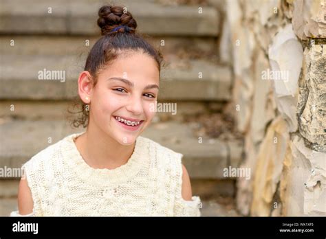Portrait Of A Happy Smiling Teenage Girl With Dental Braces Stock Photo