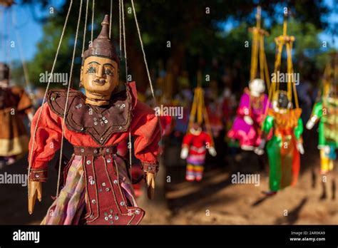 Traditional Burmese Handmade Wooden Puppet On Strings Hanging On A Tree