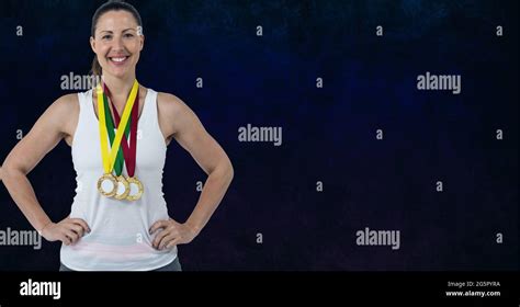 Portrait Of Caucasian Woman With Many Medals Around Her Neck Smiling Against Blue Background