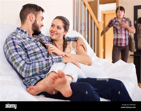 Husband Watching How Partner Is Cheating On At Home Stock Photo Alamy