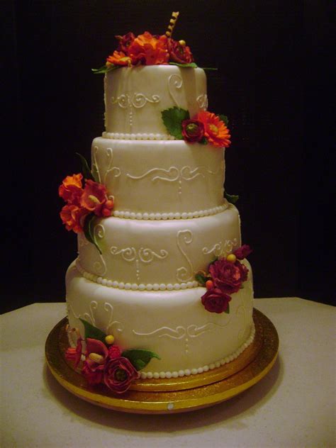Place a cake disc into the middle of the cake and mark four points around the edge with a knife. MaryMel Cakes: 4 tier wedding cake