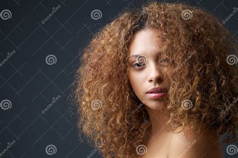 Beauty Portrait Of An Attractive Female Fashion Model With Curly Hair