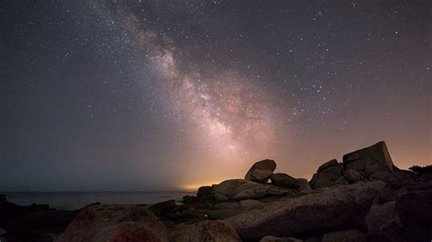 Stones Rocks Ocean Under Blue Starry Sky Milky Way During Nighttime