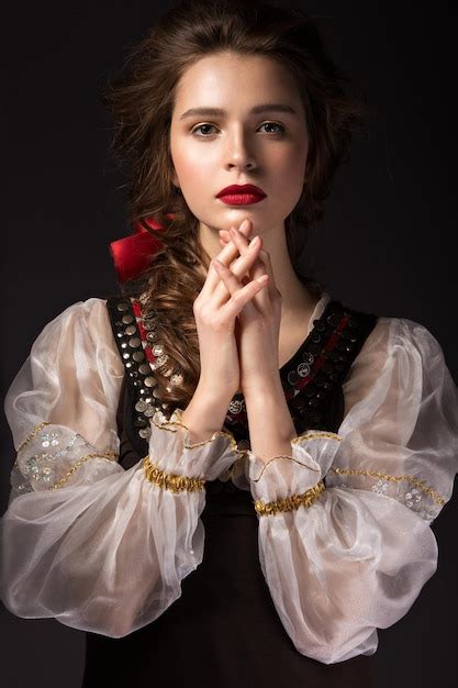 Premium Photo Beautiful Russian Girl In National Dress With A Braid Hairstyle And Red Lips