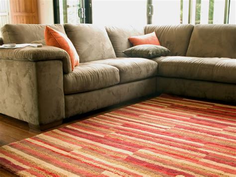 You can experiment with texture when placing rugs over carpet. 5 Carpet Hacks to Keep Your Rugs Like New