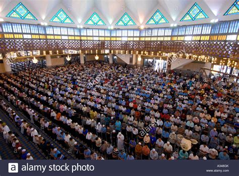 Our prayers time and date (based on malaysia time) Muslim men at Friday prayer in the National Mosque, Kuala ...