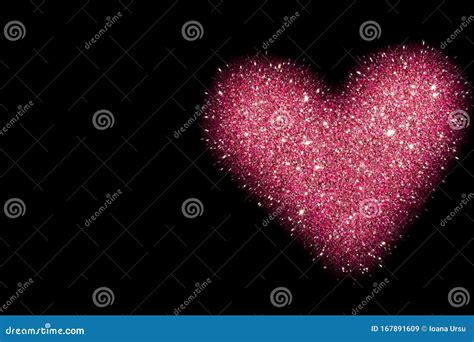 Abstract Background With Pink Heart Isolated On Black Shiny Heart With