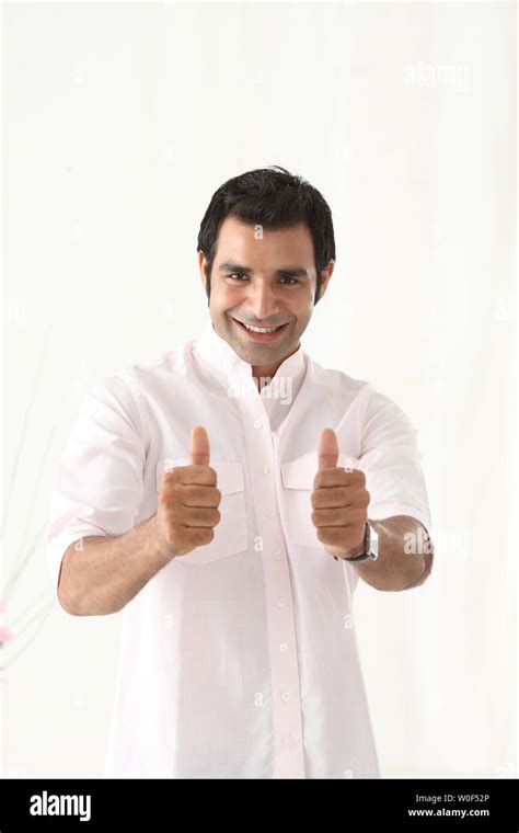 Portrait Of A Man Showing Thumbs Up Signs Stock Photo Alamy