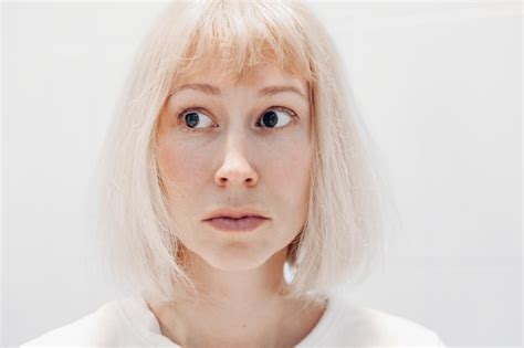Premium Photo Portrait Of A Surprised Woman On A White Background