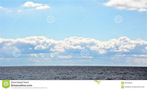 Puffy Clouds Over The Sea Stock Photo Image Of Peaceful