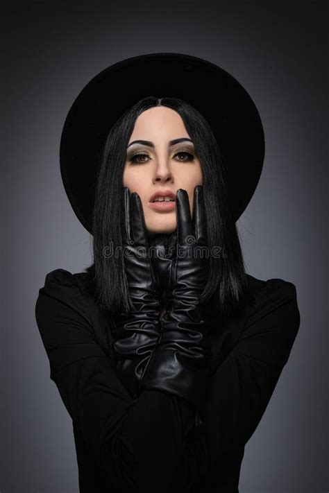 Beautiful High Fashion Model Wearing Black Hte And Leather Glove Stock