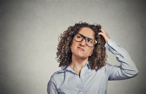 Woman With Glasses Scratching Head Thinking Confused Stock Photo